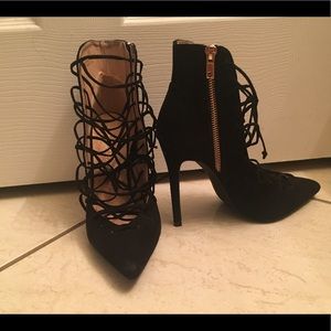 Laced up black closed toed heels